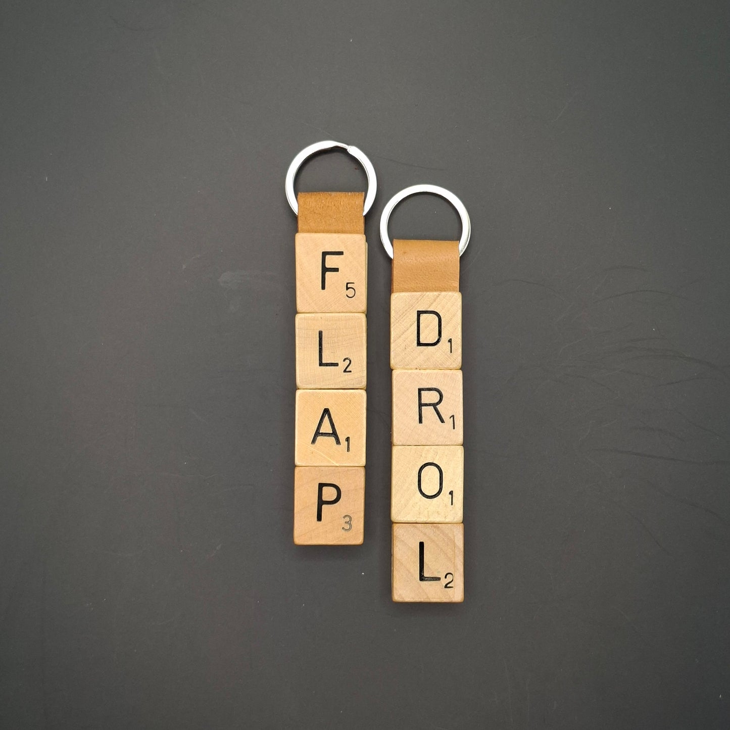 Sleutelhanger met quote: "Flap Drol"
